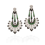 A pair of Art Deco style drop earrings featuring green emerald-cut stones, black enamel, and pavé-set clear stones on a white background.
