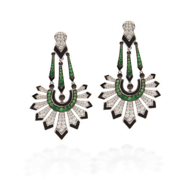 A pair of Art Deco style drop earrings featuring green emerald-cut stones, black enamel, and pavé-set clear stones on a white background.